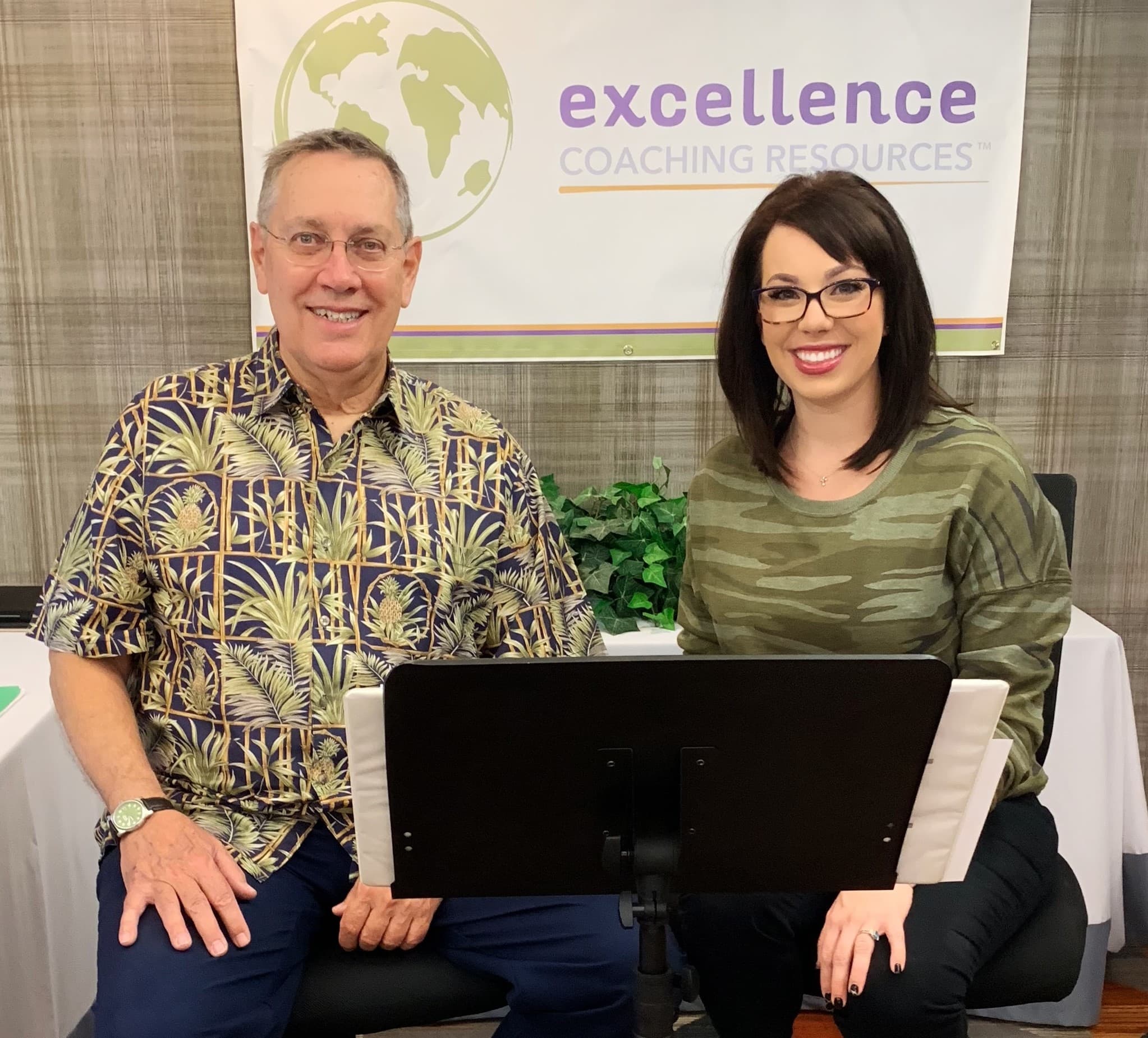 Paul and Natalie Posing Together at a Conference